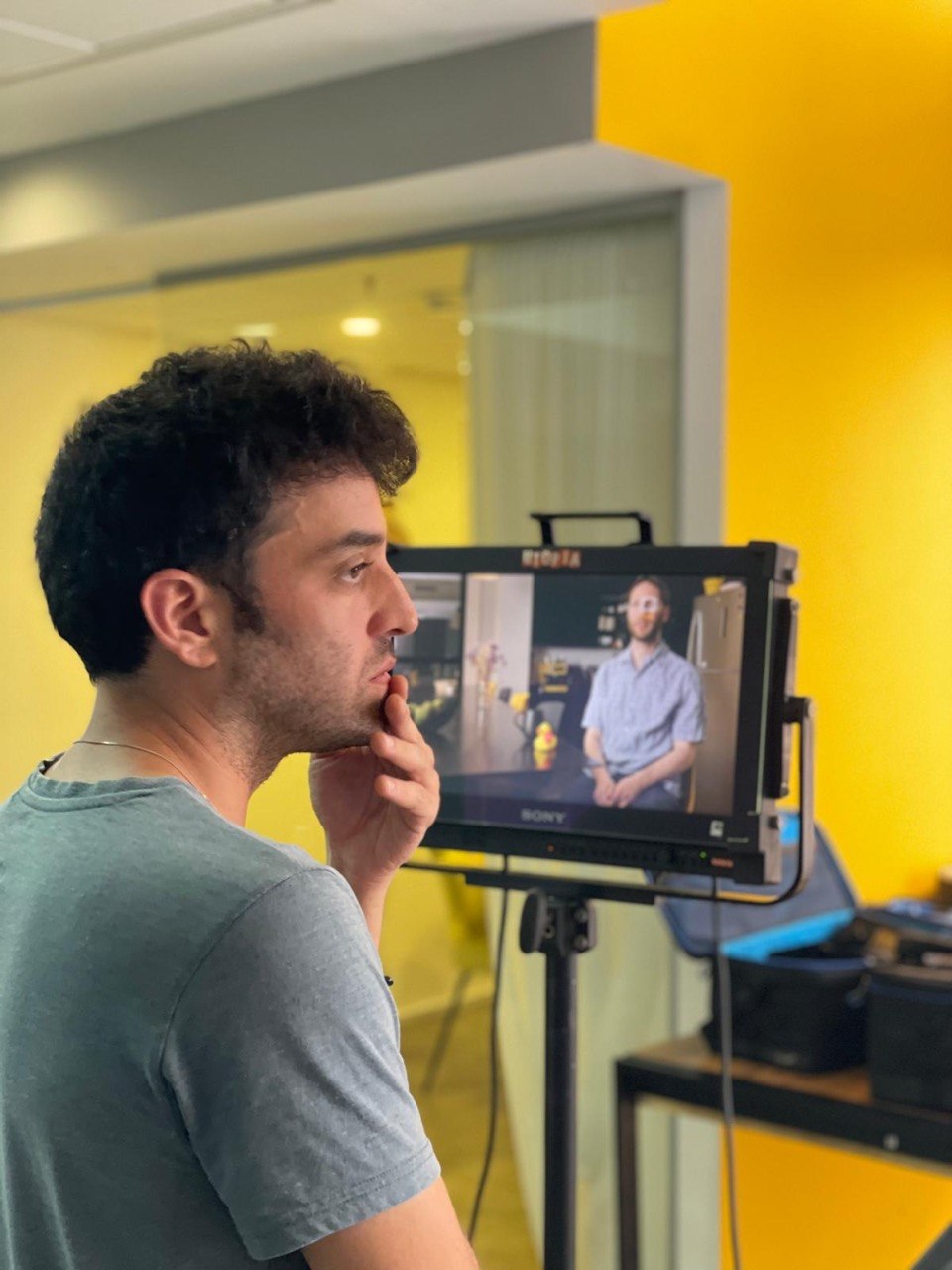 Avi Granit on set, watching the monitor